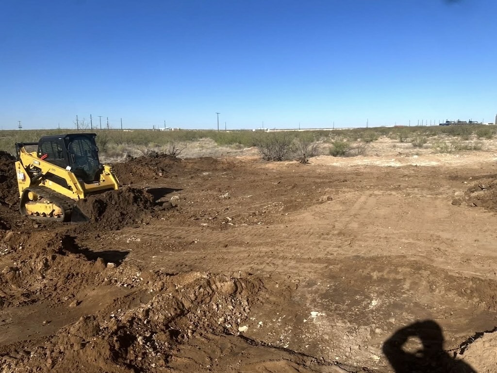 Moving earth with backhoe equipment