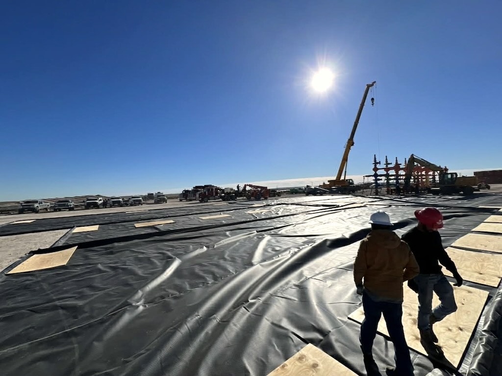 Crew working secondary spill containment