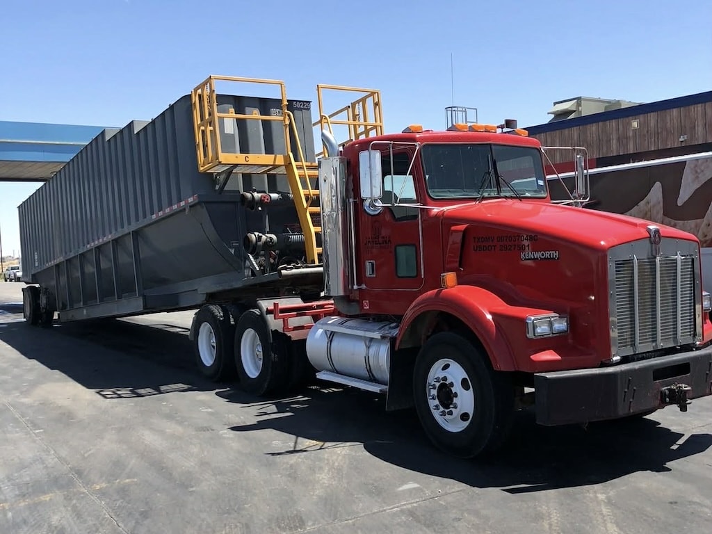 Javelina winch truck loaded with frac tank